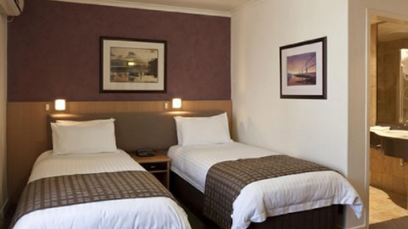 BEST WESTERN PLUS Travel Inn Hotel Logo and Images