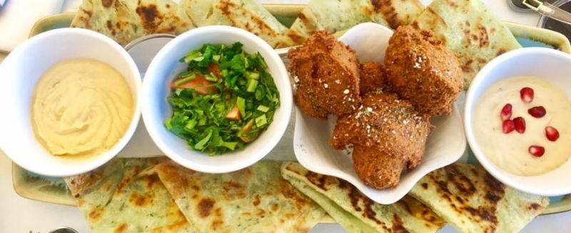 Suq Restaurant Logo and Images