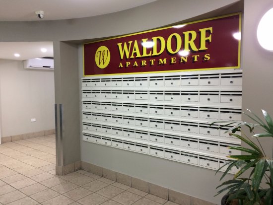 Waldorf The Entrance Apartment Hotel Logo and Images