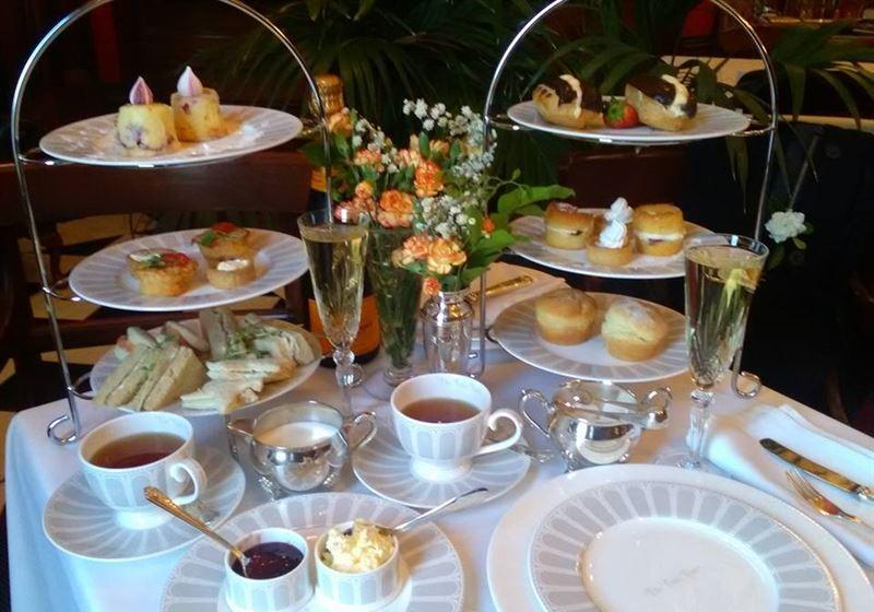 The Palm Court Tea Salon Logo and Images