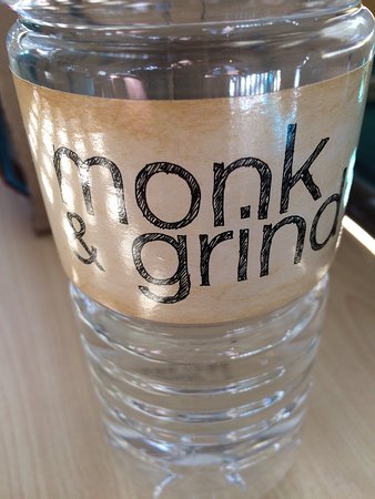 Monk& Grind Cafe and Lounge Logo and Images