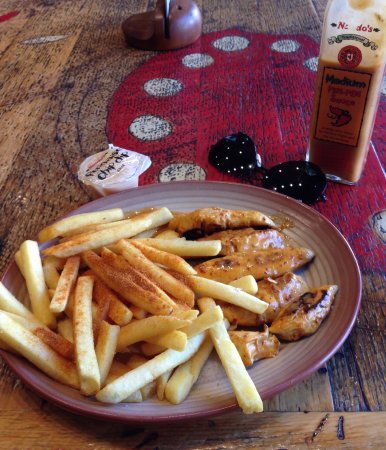 Nando's Flame Grilled Chicken Logo and Images